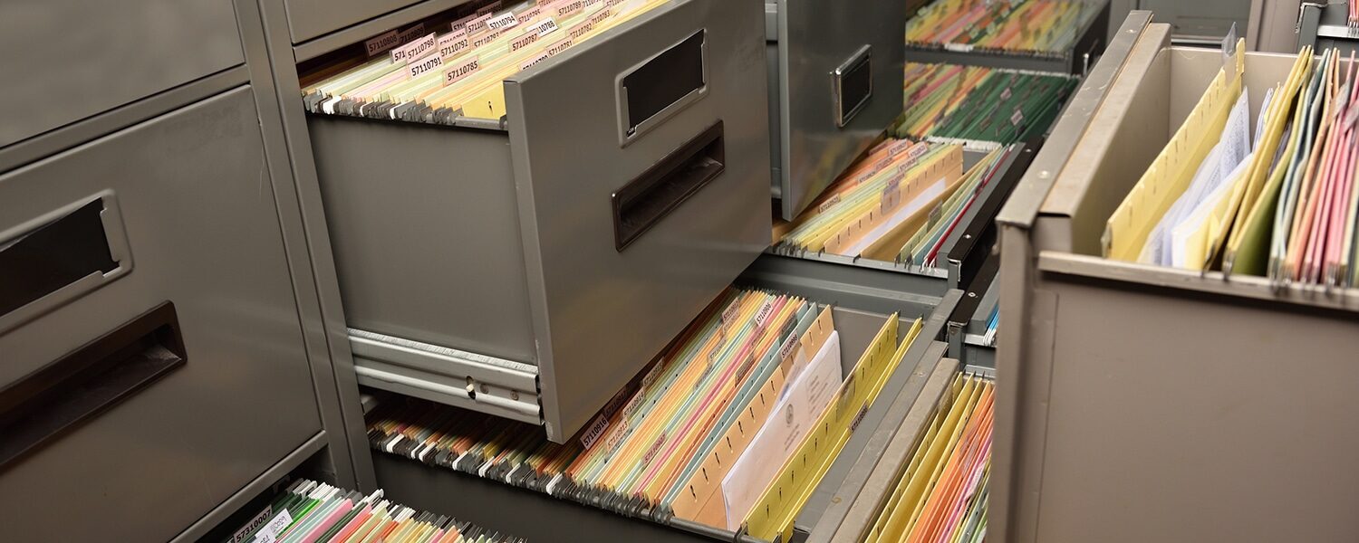 Open File Cabinets Full of Documents